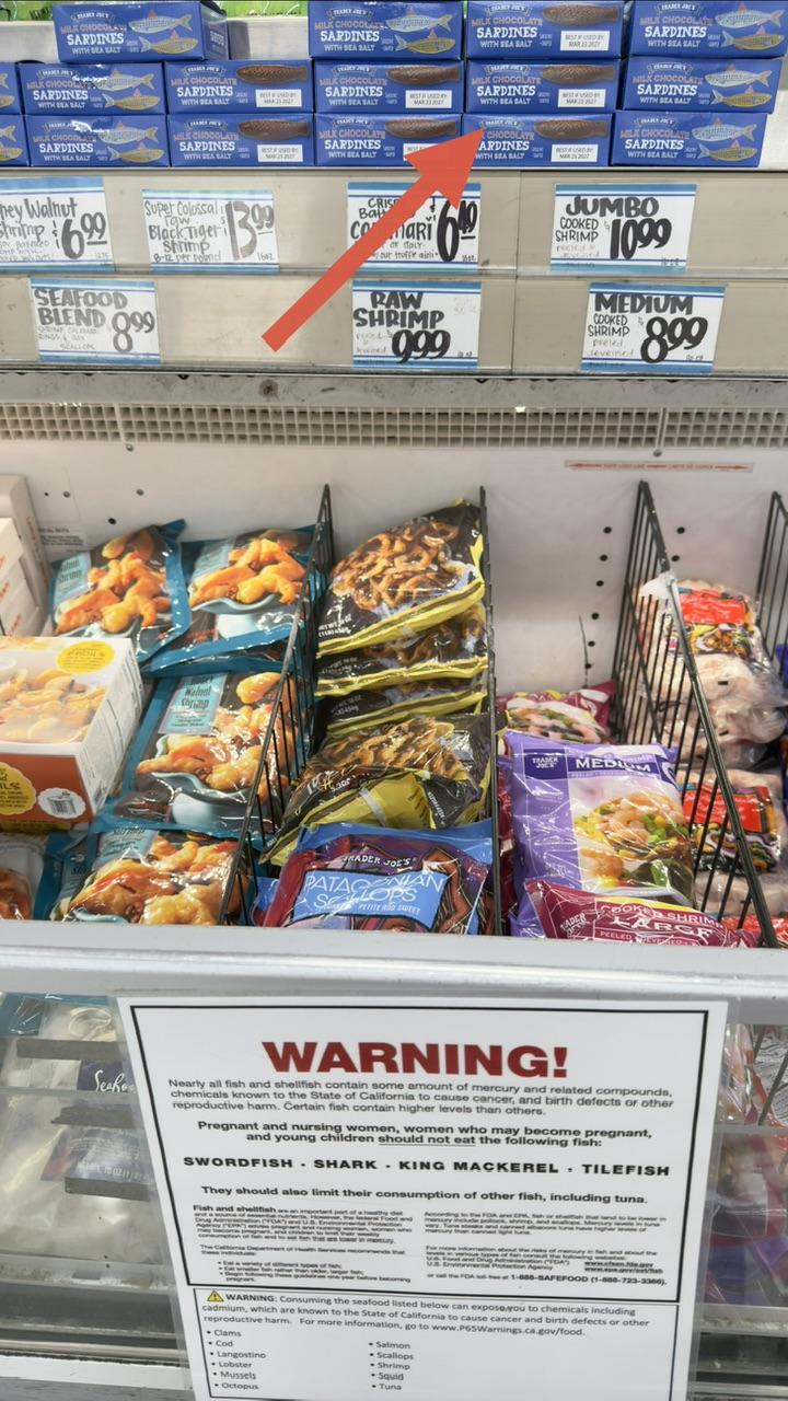Image of various frozen seafood. Stacked above our boxes of chocolate sardines!